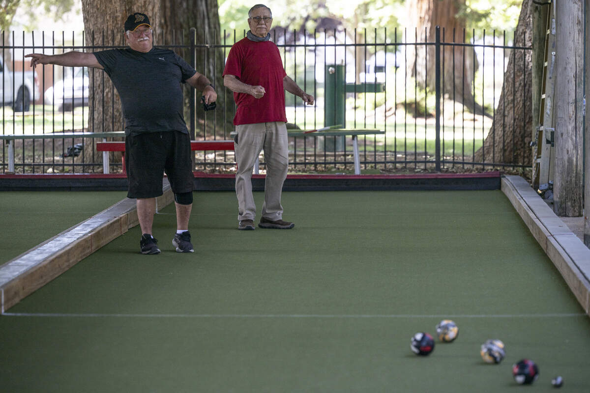 Al Velasquez and David Zaffa play bocce at East Portal Park in East Sacramento on Monday, Aug. 10, 2026. The bocce court is a focal point in East Sacramento’s historic Italian neighborhood.